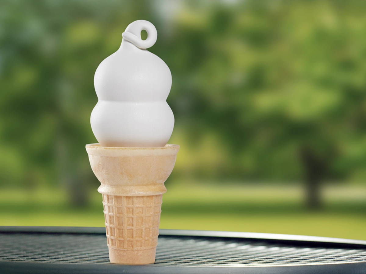 Small soft serve cone on an outdoor table